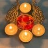 IMG-20250930-WA0052.jpg Peacock 4-Diya Urli – Decorative Metal Urli Bowl with Diyas | Festive & Home Décor