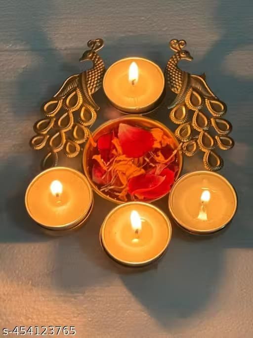 IMG-20250930-WA0052.jpg Peacock 4-Diya Urli – Decorative Metal Urli Bowl with Diyas | Festive & Home Décor